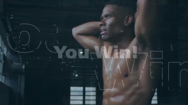 Animation of interference and you win text over african american male athlete training. Fitness, sport, health and digital interface concept digitally generated video.