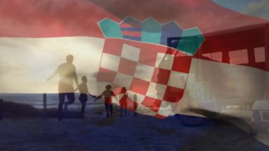 Animation of waving croatia flag over silhouette of happy family running at beach during sunset. Digital composite, multiple exposure, togetherness, vacation, love, patriotism and identity concept,