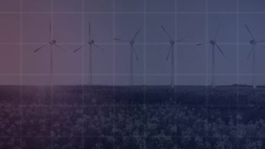 Animation of financial data and graphs over digital screen and wind turbines. Green energy, econ power, finance and economy concept digitally generated video.