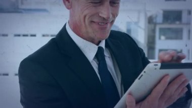 Network of connections over caucasian senior businessman using digital tablet at office. Global networking and business technology concept