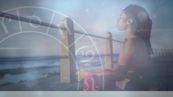 Animation Zodiac Signs Young African Woman Meditating Pier Beach Digital — Stockvideo