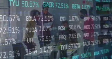 Animation of stock market data processing over diverse colleagues wearing face masks discussing. Global economy and business technology concept