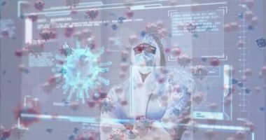 Animation of covid 19 cell and data on screen over caucasian woman un ppe suit. Global covid 19 pandemic, data processing and digital interface concept digitally generated video.