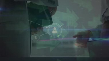 Animation of data processing over mid section of businessman and businesswoman shaking hands. Global finance and business technology concept