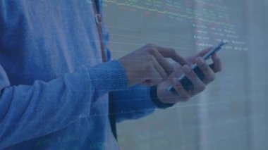 Animation of chart and trading board moving over midsection of caucasian man using mobile phone. Digital composite, multiple exposure, stock market data, investment, finance and technology concept.