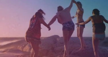 Animation of light and shapes moving over diverse group of friends at beach. Light, free time and digital interface concept digitally generated video.