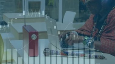 Animation of data processing over tribal african american woman using smartphone at office. Business data and analytics technology concept