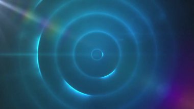 Animation of light over blue circles moving on black background. Animation of red dots over green and yellow circles moving on black background.