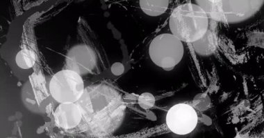 Animation of grey and white circles of light over moving white brush strokes on black background. Nature, energy and change, abstract background concept digitally generated video.