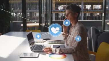 Animation of network of connections over caucasian businesswoman using smartphone. global business, connections and technology concept digitally generated video.