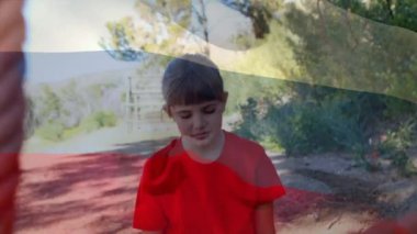 Animation of flag of russina over caucasian boy during obstacle race training. national sports, activity and patriotism concept digitally generated video.