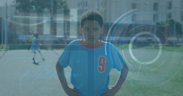 Animación Los Datos Procesamiento Interfaz Sobre Niño Biracial Tira Fútbol — Vídeos de Stock