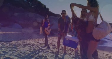 Animation of glowing lights over group of diverse female friends on beach by the sea. Friendship, summer and holiday concept digitally generated video.