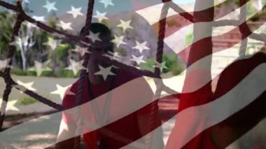 Animation of flag of usa over caucasian man and boy during obstacle race training. national sports, activity and patriotism concept digitally generated video.