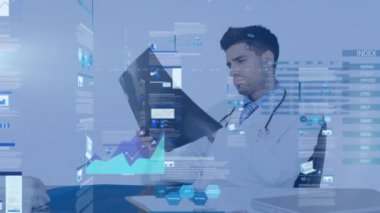 Animation of graphical infographic interface screen over caucasian male doctor holding medical x-ray. Hologram, digital composite, healthcare, futuristic, database and technology concept.