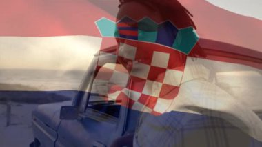 Animation of croatia flag waving over portrait of african american man standing by pick-up truck. Dreadlocks, happy, digital composite, multiple exposure, beach, vacation, patriotism, and identity.