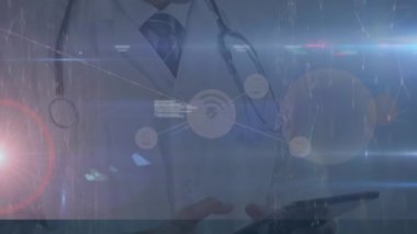 Animation of data processing, lights and connections over happy caucasian male doctor with tablet. Health, medicine, communication and technology concept digitally generated video.