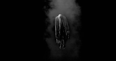 Image of moving ghost and smoke on black background. Halloween and ghosts concept digitally generated image.