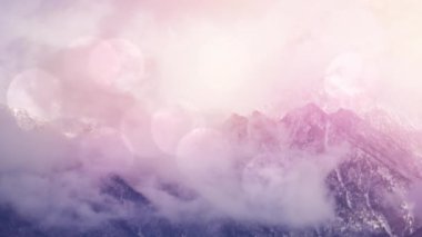 Animation of bokeh and snow falling over mountain winter landscape. Winter, christmas and celebration concept digitally generated video.