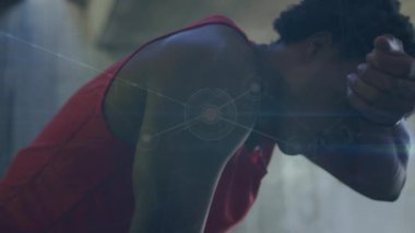 Animation of communication network processing over resting african american male athlete training. Fitness, sport, health and digital interface concept digitally generated video.