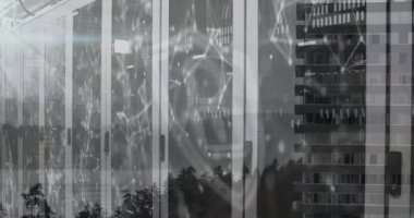 Animation of security icon with network connecting dots against office building. Digital composite, multiple exposure, artificial intelligence, safety, accessibility, protection, connection.