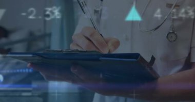 Animation of financial graphs and data over hands of caucasian male doctor making notes. Health, medicine and finance concept digitally generated video.