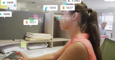 Animation of social media notifications processing data over caucasian woman working at office desk. Global communication network, digital interface and social media concept digitally generated video.