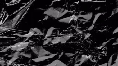 Animation of white scratch lines over moving scrunched texture black background. Creativity, imagination and change, monochrome abstract background concept digitally generated video.