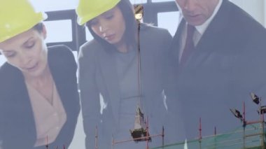 Animation of diverse business people over building site. global business, computing and digital interface concept digitally generated video.