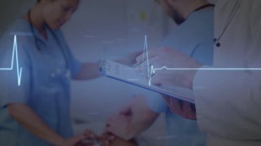 Animation of glowing heart rate monitor over diverse doctors. Global healthcare services, health and data processing concept digitally generated video.