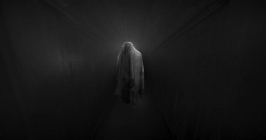 Image of moving ghost and buildings on black background. Halloween and ghosts concept digitally generated image.