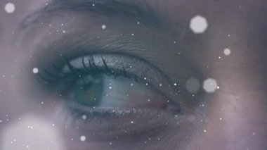 Slow motion close-up shot of bokeh animation and woman closing eyes. Digital composite, human eye, sensory perception, vision.