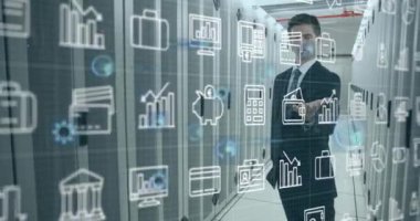 Animation of digital icons over caucasian businessman holding an invisible object at server room. Business data and storage technology concept