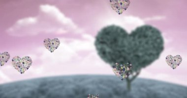 Animation of heart icons floating over heart tree. Valentines day and celebration concept digitally generated video.