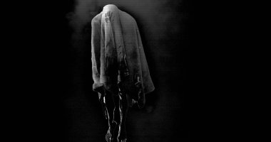 Image of moving ghost and smoke on black background. Halloween and ghosts concept digitally generated image.