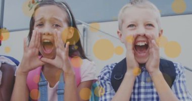 Animation of orange circles over happy diverse schoolchildren having fun shouting. Education, childhood, digital interface and social media concept digitally generated video.