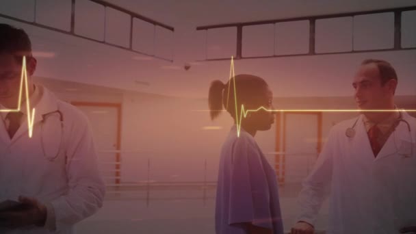 Animation Glowing Heart Rate Monitor Diverse Doctors Global Healthcare Services — Vídeo de stock