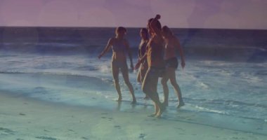 Animation of glowing lights over group of diverse female friends by the sea. Friendship, summer and holiday concept digitally generated video.