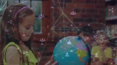 Animation of network of connections with icons over happy caucasian girl with globe at school. learning geography, education, connections and technology concept digitally generated video.