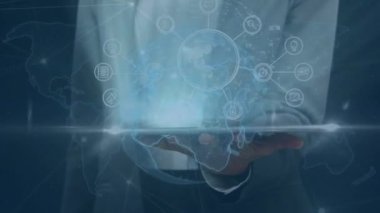 Animation of network of conncetions and globe over biracial businesswoman using tablet. global business, data processing and technology concept digitally generated video.