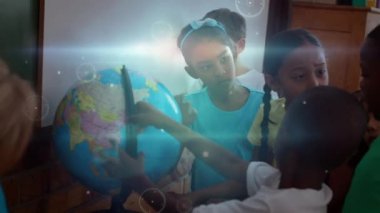 Animation of network of connections with icons over diverse pupils with globe at school. learning geography, education, connections and technology concept digitally generated video.