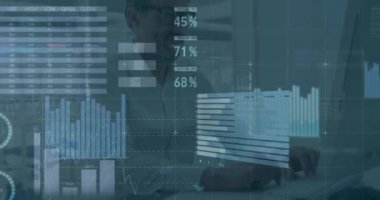 Animation of data processing over caucasian businessman using laptop at office. Global business, computing and digital interface concept digitally generated video.