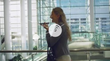 Animation of network of connections icons over caucasian businesswoman using smartphone. Global business, technology, computing, data processing and networks concept digitally generated video.