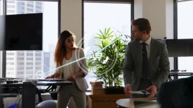 Computer icons connecting with lines over caucasian coworkers discussing in meeting room. Animation, digital composite, multiple exposure, business, teamwork, documents and office concept.