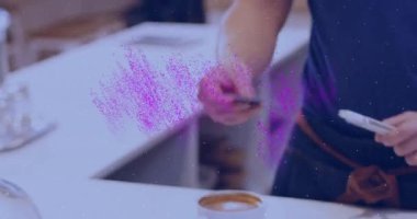 Animation of nft text banner over mid section of man making a payment by his credit card. Cryptocurrency and digital payment technology concept