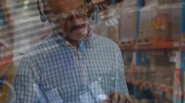 Animation of statistical data processing over caucasian senior male supervisor using digital tablet. Logistics business and technology concept