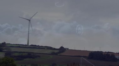 Animation of mathematical equations over spinning windmill against clouds in the sky. Global networking and business technology concept