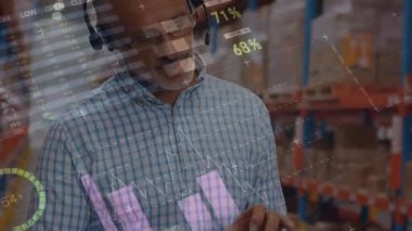 Animation of statistical data processing over caucasian senior male supervisor using digital tablet. Logistics business and technology concept