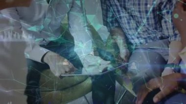 Animation of network of profile icons over group of diverse office colleagues discussing at office. Global networking and business technology concept