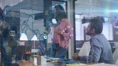 Animation of data processing over world map against diverse businesspeople discussing at office. Global networking and business technology concept